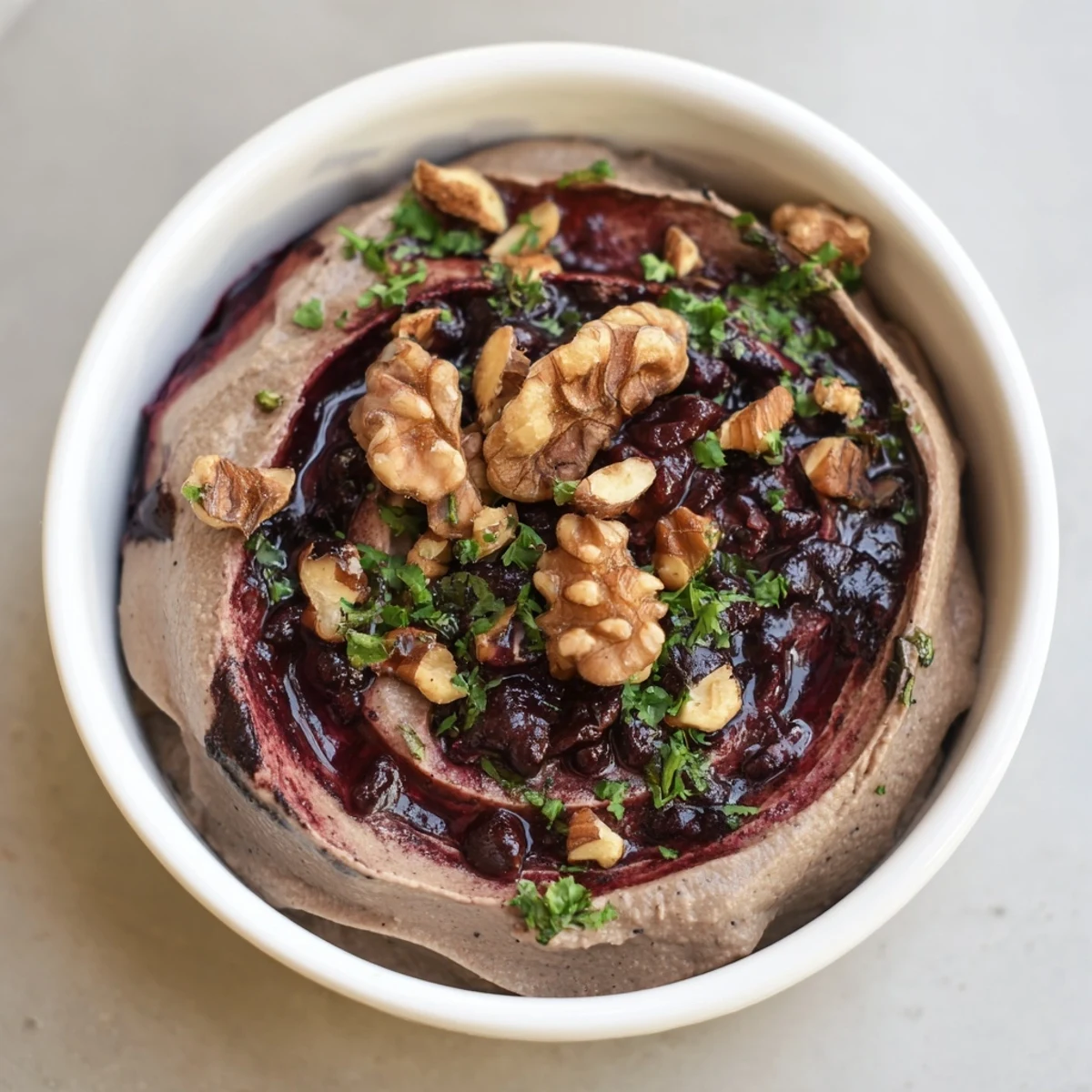 Creamy layers of The Velvet Underground appetizer with dark pâté, jam, and crunchy nuts, ready to serve.