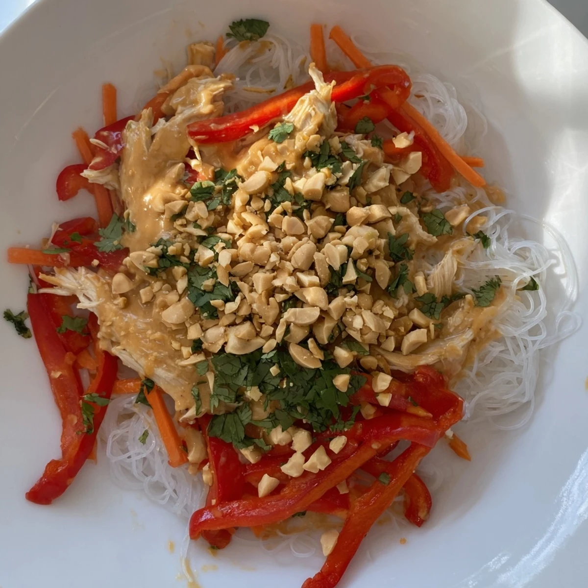 Creamy Thai-Inspired Peanut Chicken Pasta, tossed with fresh veggies, ready for a cool summer lunch.