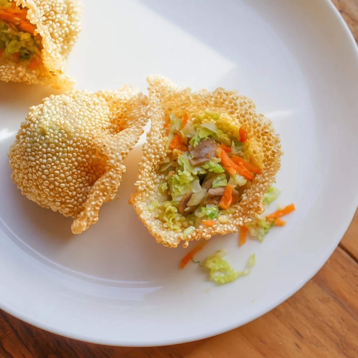 Golden-brown and crispy rice paper dumplings, filled with savory vegetables, ready to eat.
