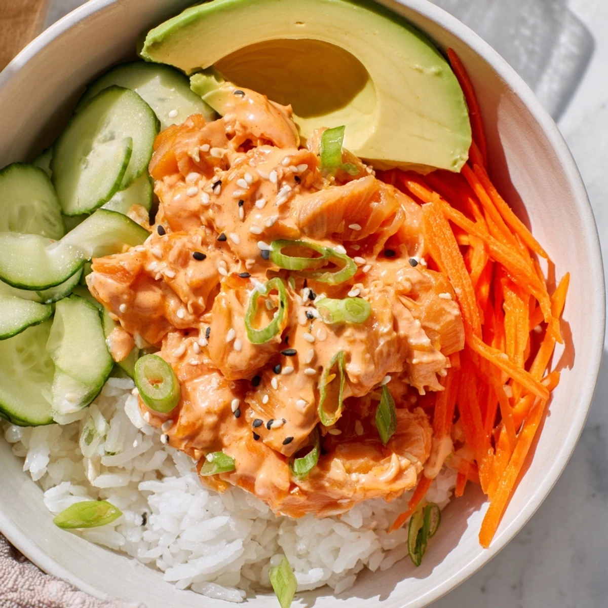 Spicy Canned Salmon Rice Bowl with vibrant colors and creamy sriracha mayo, ready to eat.