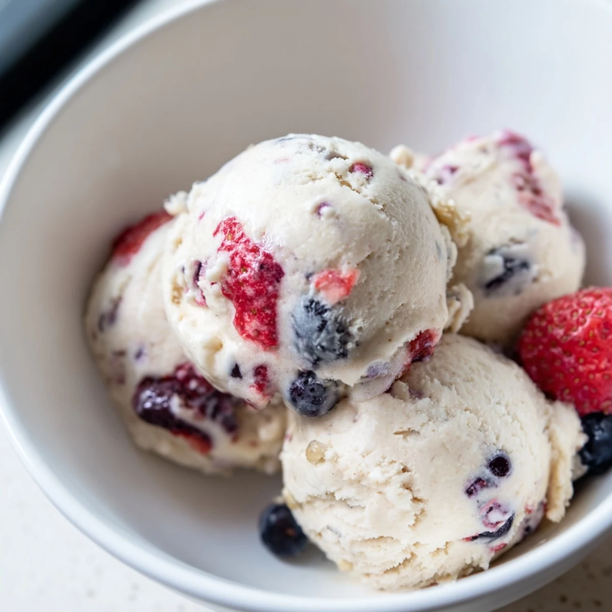 A bowl overflowing with smooth cottage cheese ice cream, ready to be enjoyed on a hot day.