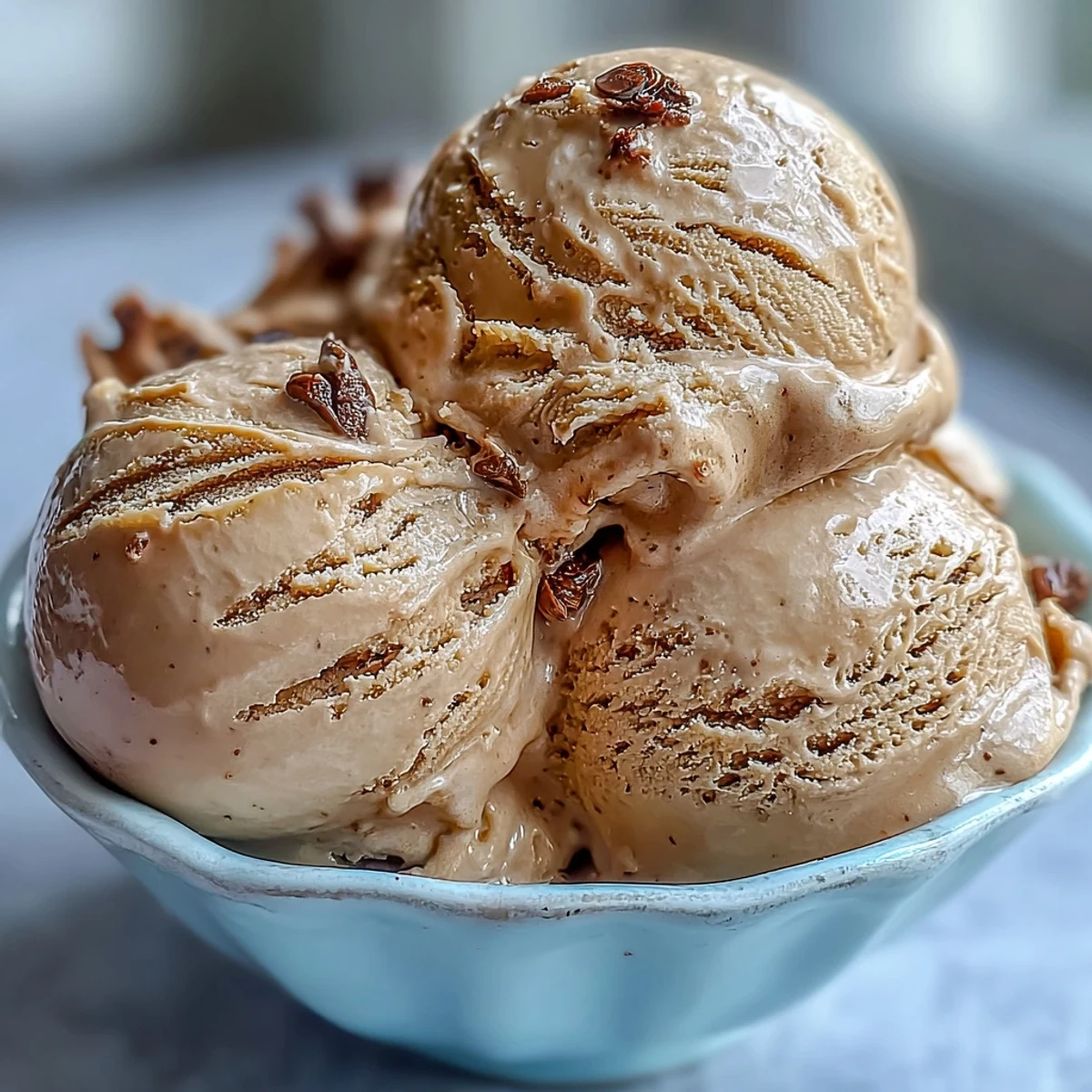 Hojicha Ice Cream in a bowl, creamy beige texture with toasted sesame seeds, served Japanese-style.