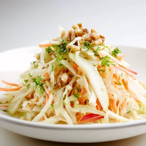 Crisp sauerkraut and apple slaw drizzled with honey mustard dressing.