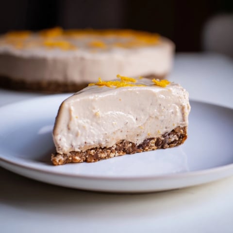 Lebkuchen Cheesecake slice topped with cinnamon frosting, ready to serve this holiday season.