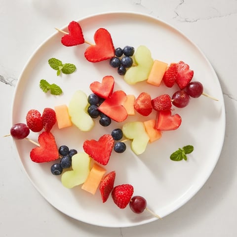 Vibrant photo of delicious Berry Good Heart Fruit Skewers, a refreshing, colorful, and healthy snack.
