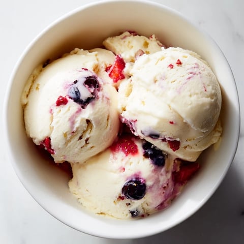Creamy cottage cheese ice cream with mixed berries, a cool and refreshing homemade dessert.