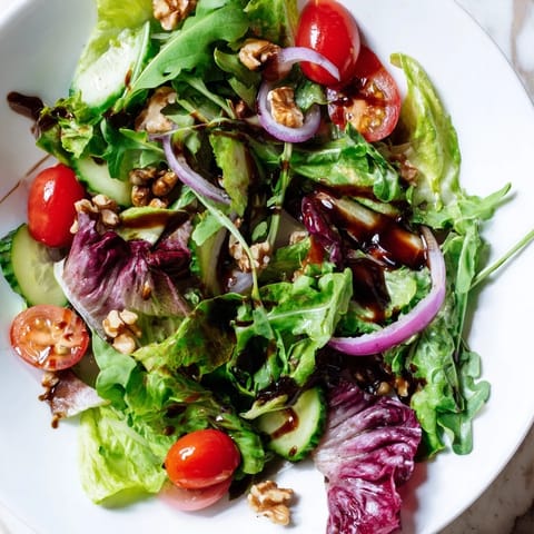 This Quick Balsamic Vinegar Salad features bright greens, red onions, and a shimmering balsamic glaze.