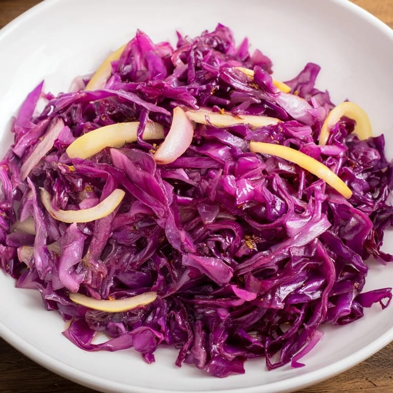 Steaming Bavarian Red Cabbage and Apple side dish, vibrant and tangy, ideal for your next dinner.